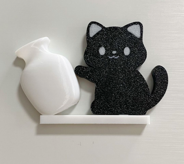 Black Cat acrylic refrigerator magnet with white tilted vase, approximately 6 cm long