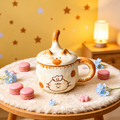 Chef Cat ceramic mug with a cat-ear lid and tall curved tail knob, styled with macarons.