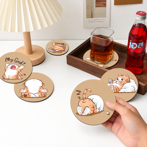 Six orange-cat coasters shown on a desk with one held in hand.
