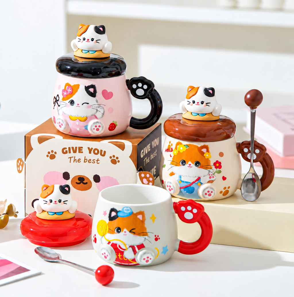 Red, brown and black cat mugs showing removable lids and matching spoons.