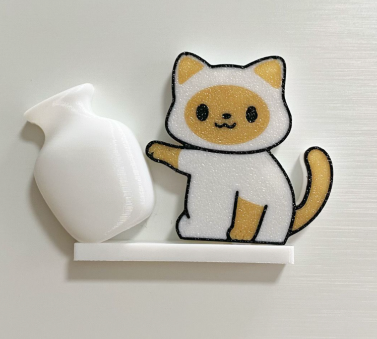 Cream Cat acrylic refrigerator magnet with white tilted vase, approximately 6 cm long