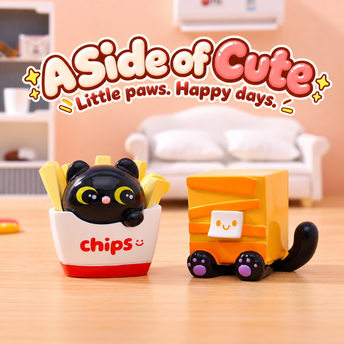 Black cat in a white chips carton beside a yellow box cat with purple paw pads.