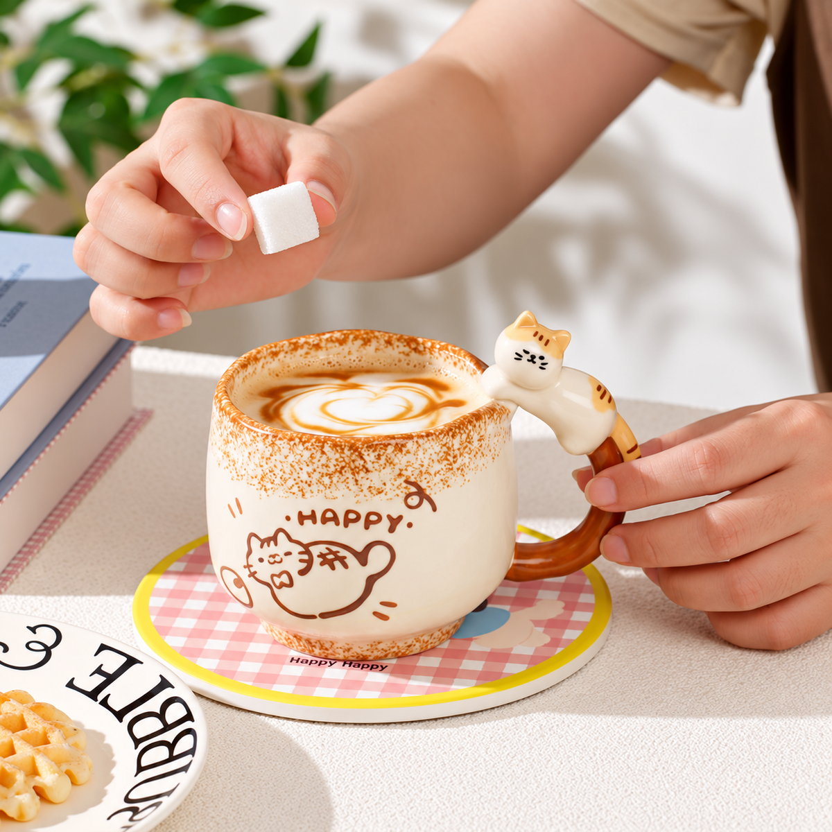 Happy cat ceramic mug with a sculpted cat handle during a coffee break.