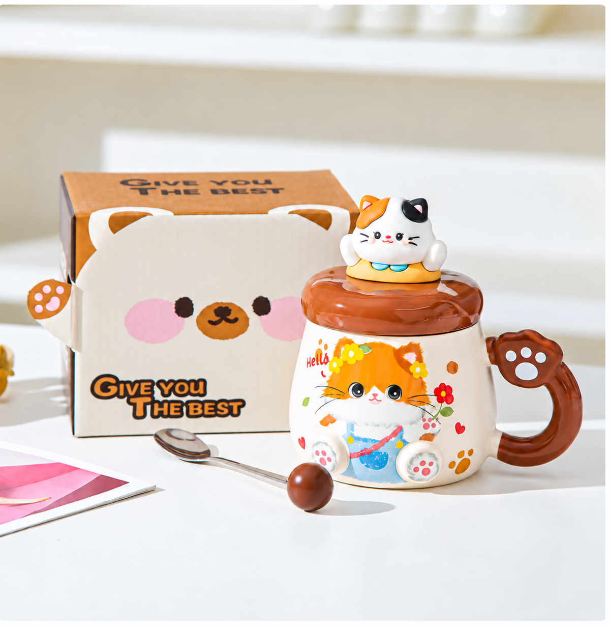 Brown cat mug with matching lid, spoon and standard box.