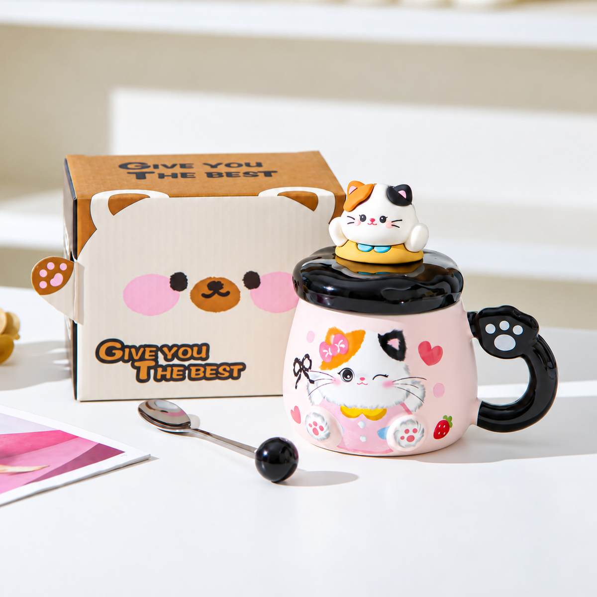 Black-accent cat mug with matching lid, spoon and standard box.