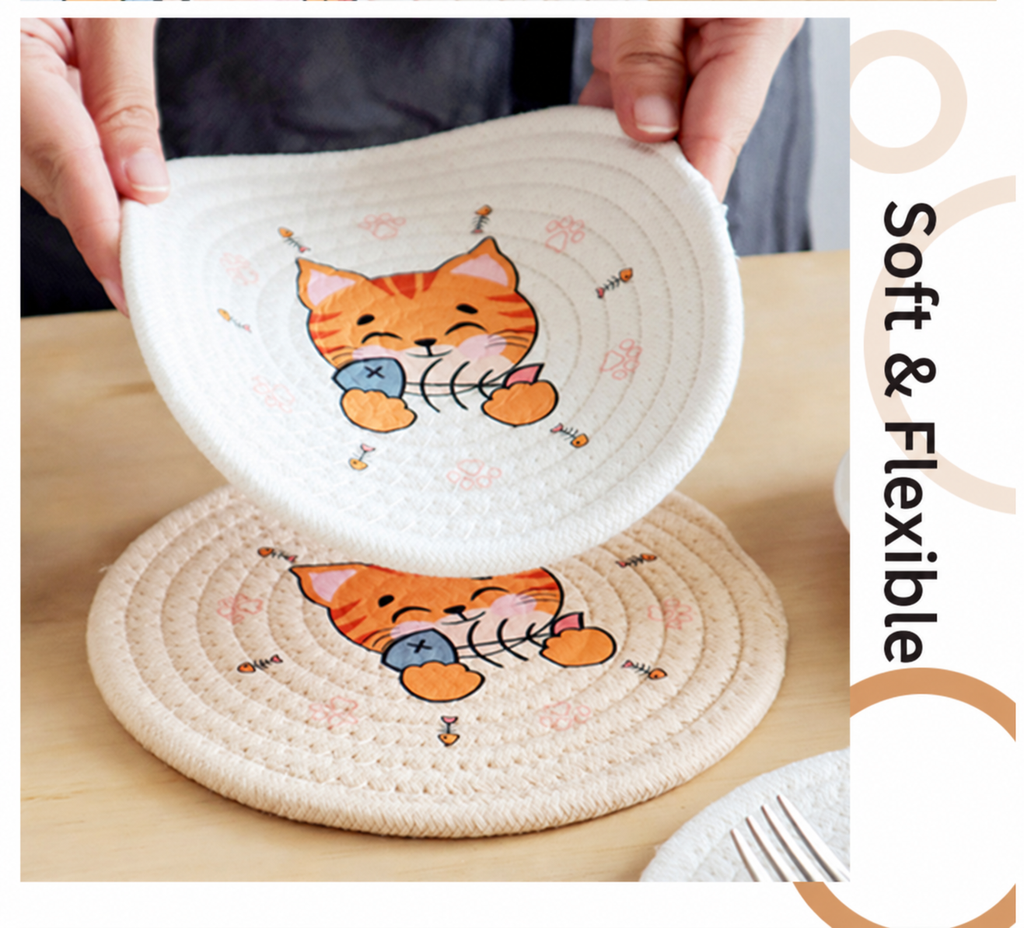 Soft flexible ivory orange cat rope coaster held by hand.