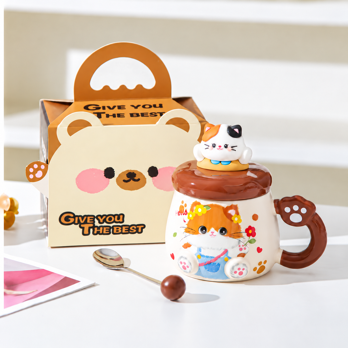 Brown cat mug with matching lid, spoon and handled gift box.